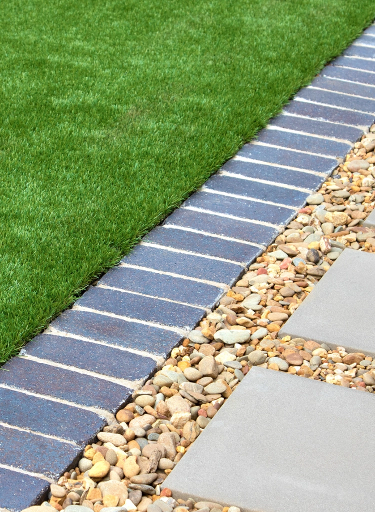 Modern Backyard Design with Artificial Grass Rocks and Tiles