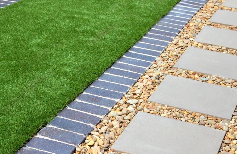Modern Backyard Design with Artificial Grass Rocks and Tiles
